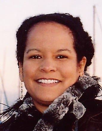 Portrait of Staci Collins smiling outdoors.