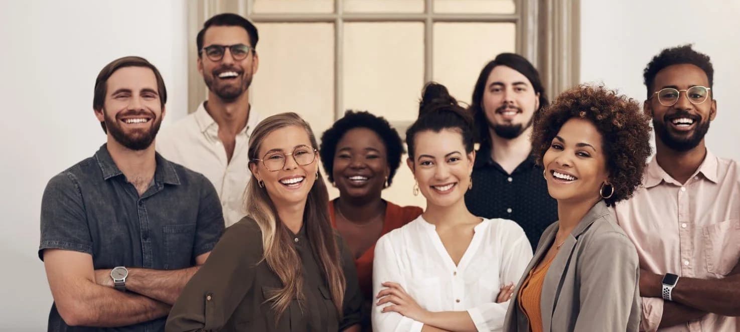 A group of professionals smiling together.